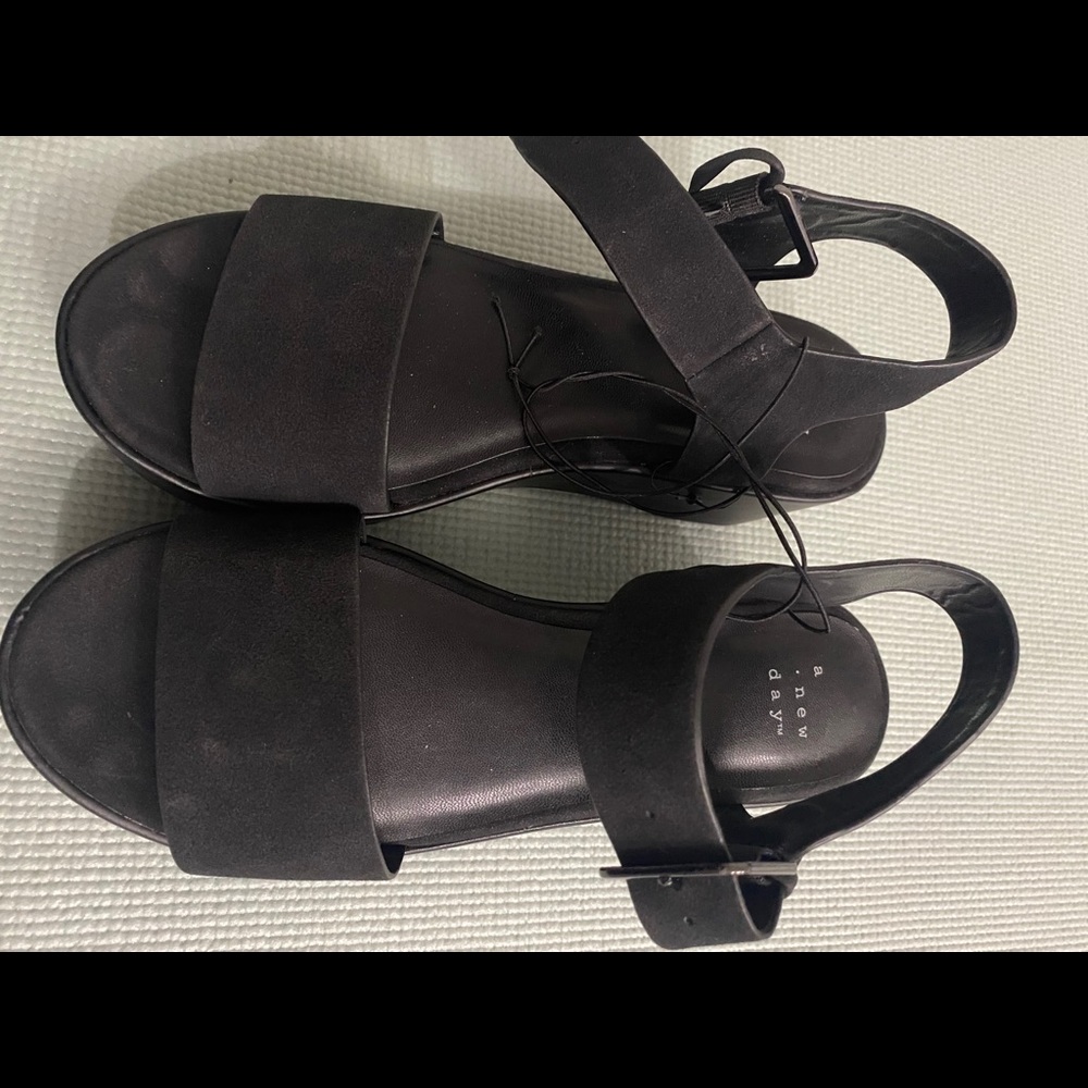 Black flat form sandals